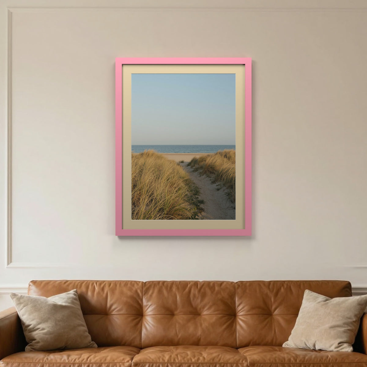 Baby Pink picture frame with an ivory mount hanging on a living room wall