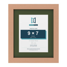 Beech 12 x 10 inch picture frame with a green mount for a 9 x 7 inch photo