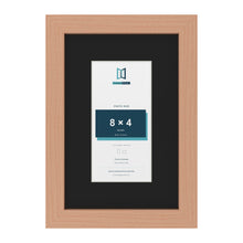 Beech 12 x 8 inch picture frame with a black mount for an 8 x 4 inch photo