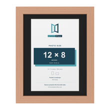 Beech 14 x 11 inch picture frame with a black mount for a 12 x 8 inch photo