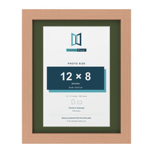 Beech 14 x 11 inch picture frame with a green mount for a 12 x 8 inch photo