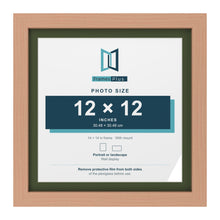 Beech 14 x 14 inch picture frame with a green mount for a 12 x 12 inch photo