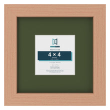 Beech 8 x 8 inch picture frame with a green mount for a 4 x 4 inch photo