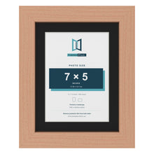 Beech 9 x 7 inch picture frame with a black mount for a 7 x 5 inch photo