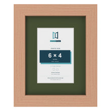 Beech 9 x 7 inch picture frame with a green mount for a 6 x 4 inch photo