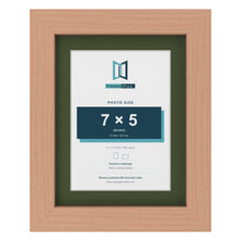 Beech 9 x 7 inch picture frame with a green mount for a 7 x 5 inch photo