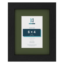 Black 9 x 7 inch picture frame with a green mount for a 6 x 4 inch photo
