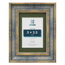 Cassis Blue 7 x 5 inch picture frame with a green mount for a 5 x 3.5 inch photo