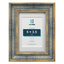 Cassis Blue 7 x 5 inch picture frame with a white mount for a 5 x 3.5 inch photo