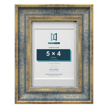 Cassis Blue 7 x 5 inch picture frame with a white mount for a 5 x 4 inch photo