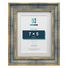 Cassis Blue 9 x 7 inch picture frame with a white mount for a 7 x 5 inch photo