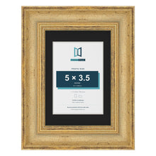 Cassis Gold 7 x 5 inch picture frame with a black mount for a 5 x 3.5 inch photo