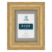Cassis Gold 7 x 5 inch picture frame with a dawn grey mount for a 5 x 3.5 inch photo
