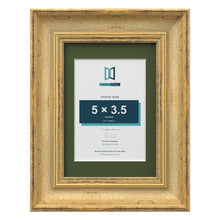 Cassis Gold 7 x 5 inch picture frame with a green mount for a 5 x 3.5 inch photo