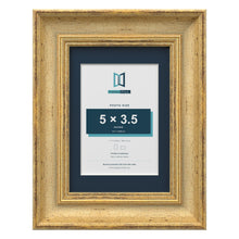 Cassis Gold 7 x 5 inch picture frame with a pacific blue mount for a 5 x 3.5 inch photo