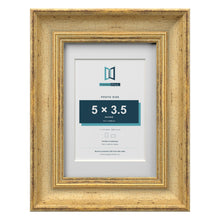 Cassis Gold 7 x 5 inch picture frame with a white mount for a 5 x 3.5 inch photo