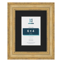 Cassis Gold 9 x 7 inch picture frame with a black mount for a 6 x 4 inch photo