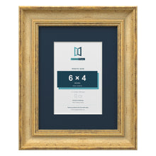 Cassis Gold 9 x 7 inch picture frame with a pacific blue mount for a 6 x 4 inch photo