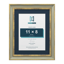 Cassis Green 14 x 11 inch picture frame with a pacific blue mount for an 11 x 8 inch photo
