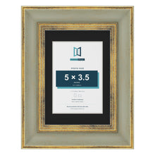Cassis Green 7 x 5 inch picture frame with a black mount for a 5 x 3.5 inch photo