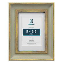 Cassis Green 7 x 5 inch picture frame with a white mount for a 5 x 3.5 inch photo