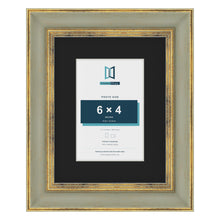 Cassis Green 9 x 7 inch picture frame with a black mount for a 6 x 4 inch photo