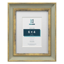Cassis Green 9 x 7 inch picture frame with a white mount for a 6 x 4 inch photo