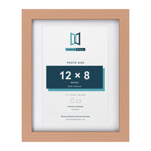 Classic Beech 14 x 11 inch picture frame with a white mount for a 12 x 8 inch photo