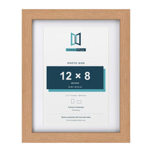 Classic Oak 14 x 11 inch picture frame with a white mount for a 12 x 8 inch photo