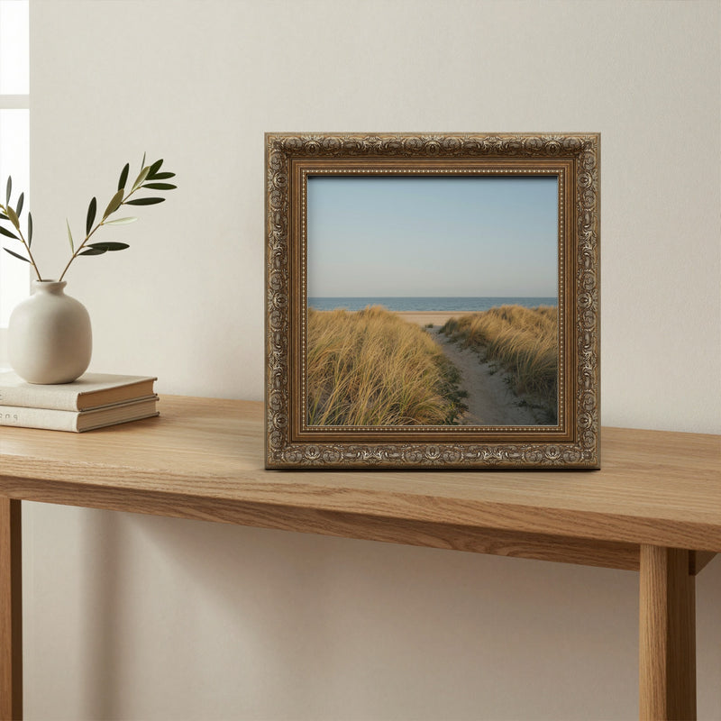 Dahlia Bronze picture frame, standing on a table