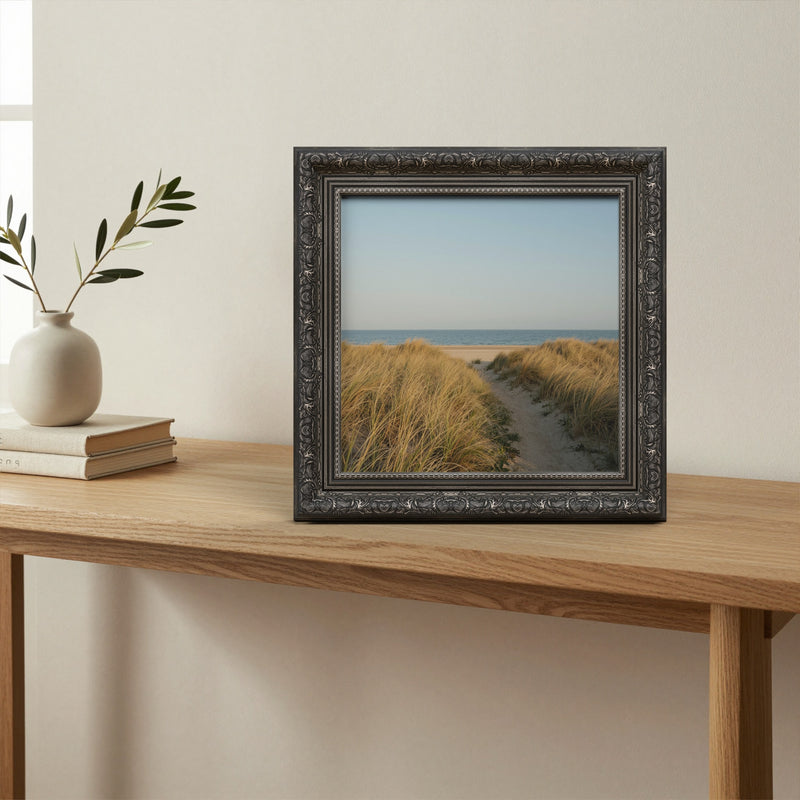 Dahlia Ebony picture frame, standing on a table