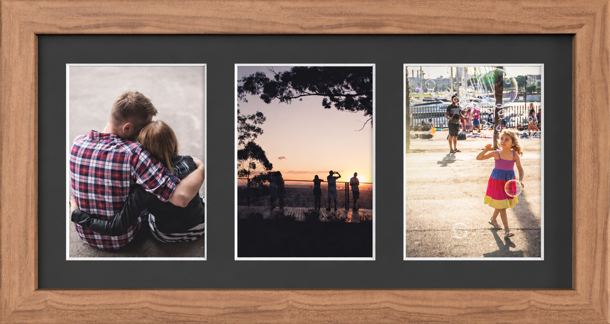Dark Oak Multi-Aperture Frame for 3 Photos 7x5" with Black Mount displaying photographs