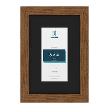 Dark Oak 12 x 8 inch picture frame with a black mount for an 8 x 4 inch photo