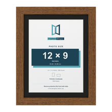 Dark Oak 14 x 11 inch picture frame with a black mount for a 12 x 9 inch photo