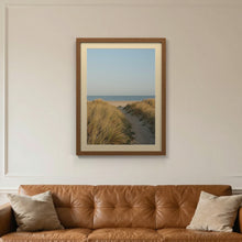 Dark Oak picture frame with an ivory mount hanging on a living room wall
