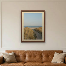Dark Teak picture frame with an ivory mount hanging on a living room wall