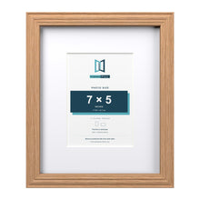 Devon Oak 11 x 9 inch picture frame with a white mount for a 7 x 5 inch photo