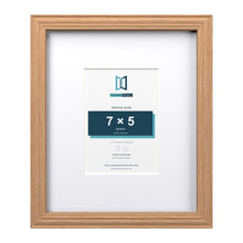 Devon Oak 12 x 10 inch picture frame with a white mount for a 7 x 5 inch photo