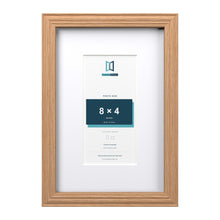 Devon Oak 12 x 8 inch picture frame with a white mount for an 8 x 4 inch photo