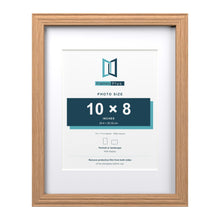 Devon Oak 14 x 11 inch picture frame with a white mount for a 10 x 8 inch photo