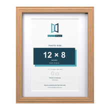 Devon Oak 14 x 11 inch picture frame with a white mount for a 12 x 8 inch photo