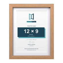 Devon Oak 14 x 11 inch picture frame with a white mount for a 12 x 9 inch photo