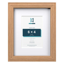 Devon Oak 9 x 7 inch picture frame with a white mount for a 6 x 4 inch photo