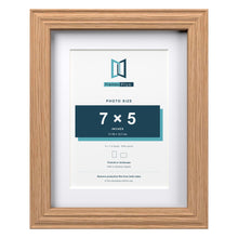 Devon Oak 9 x 7 inch picture frame with a white mount for a 7 x 5 inch photo