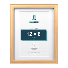 Devon Pine 14 x 11 inch picture frame with a white mount for a 12 x 8 inch photo