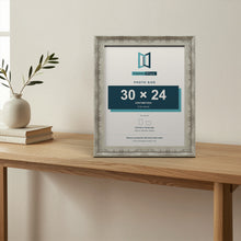 Exmouth Distressed Blue picture frame, standing on a table