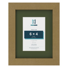 Gold 9 x 7 inch picture frame with a green mount for a 6 x 4 inch photo