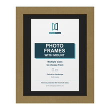 Gold picture frame with a black mount
