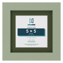 Green 7 x 7 inch picture frame with a green mount for a 5 x 5 inch photo