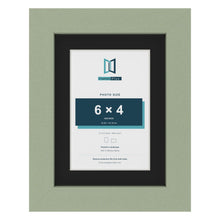 Green 8 x 6 inch picture frame with a black mount for a 6 x 4 inch photo